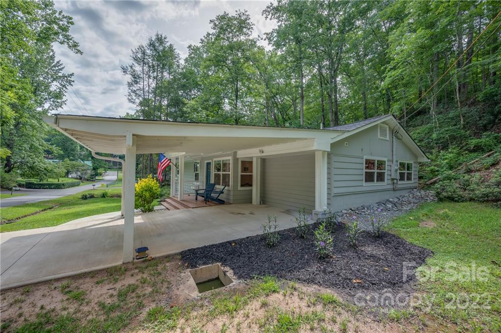 111 Jervey Road Tryon, NC 28782 - Photo 30 of 34 a view of a house with garden