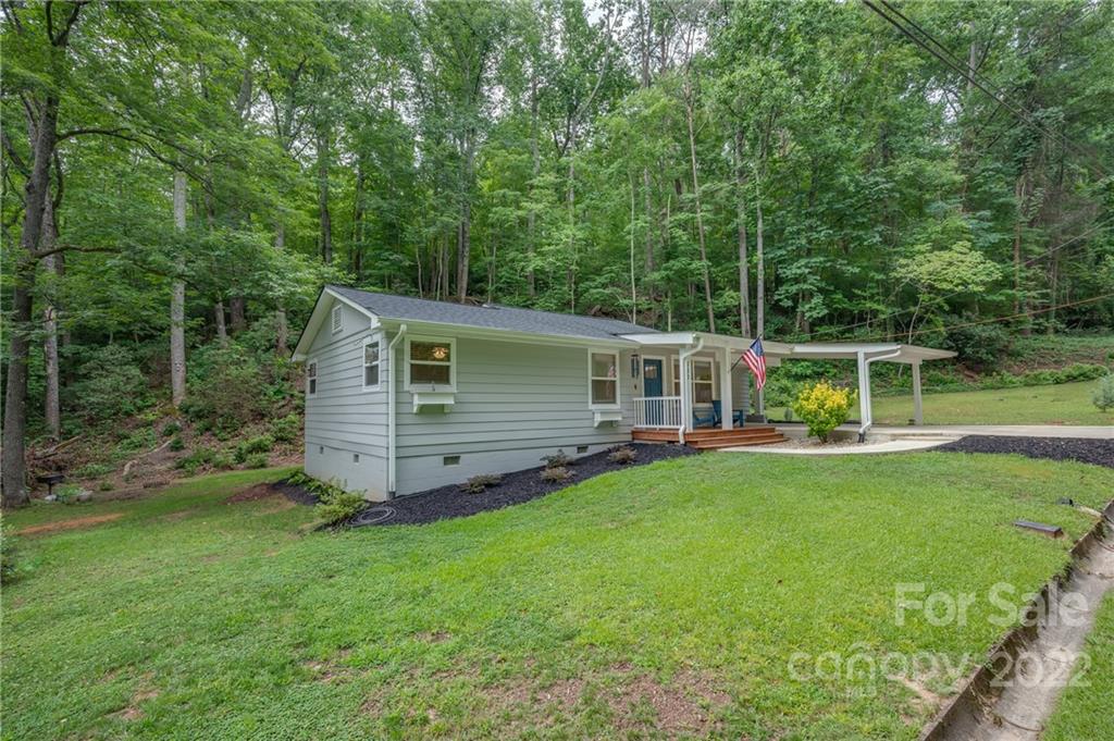 111 Jervey Road Tryon, NC 28782 - Photo 32 of 34 a view of a house with backyard