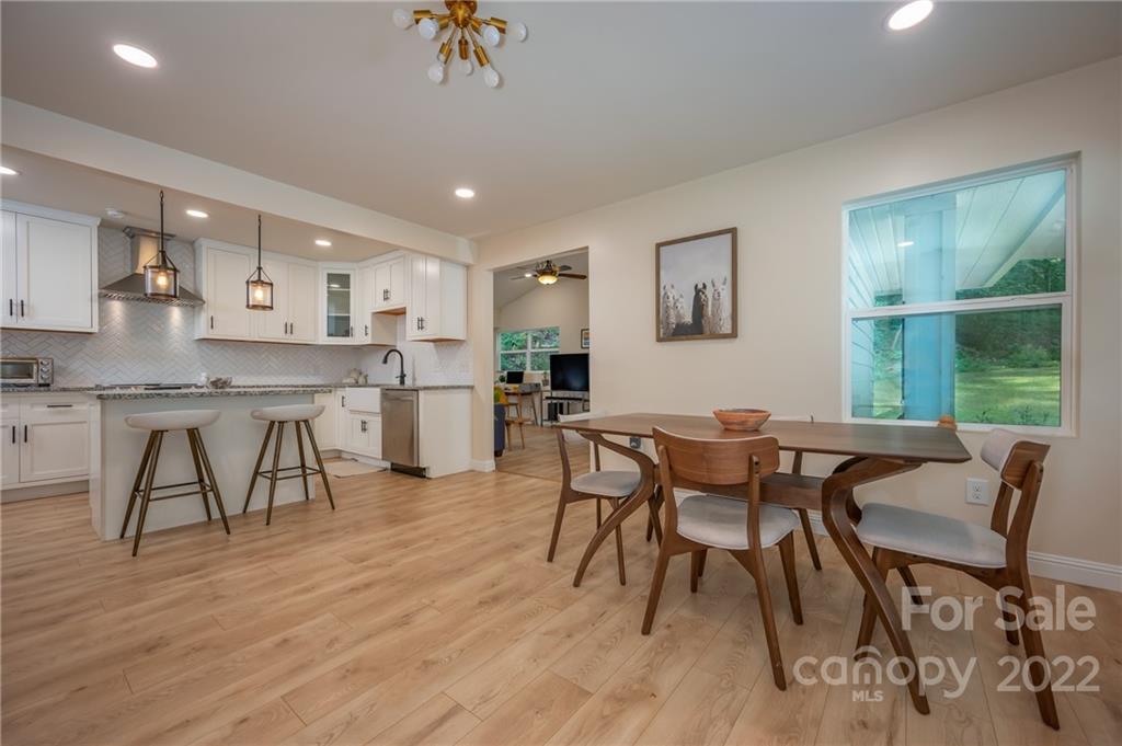 111 Jervey Road Tryon, NC 28782 - Photo 7 of 34 a view of a dining room with furniture and wooden floor