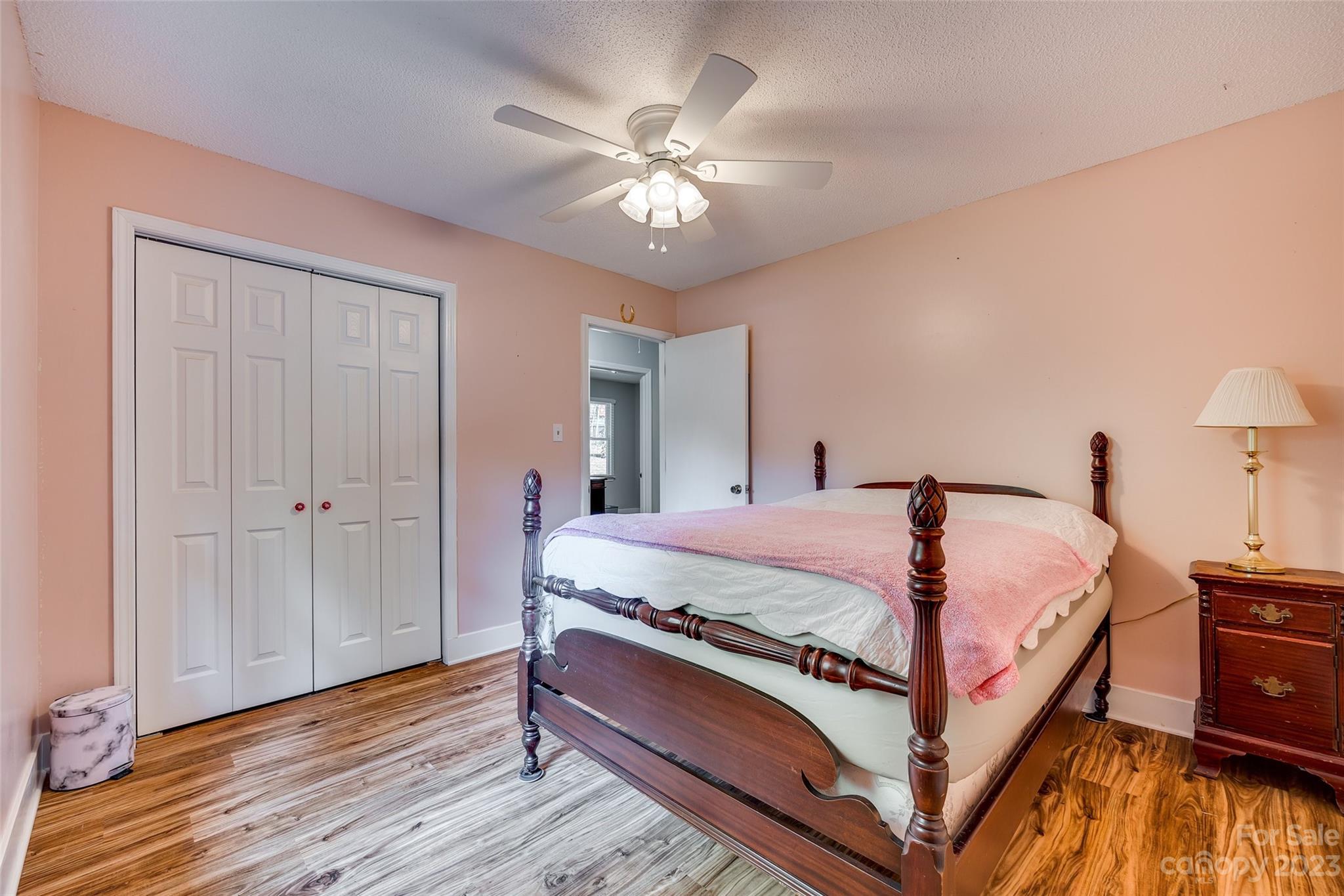 16064 Taku Court Tega Cay, SC 29708 - Photo 23 of 31 a bed room with a bed and a chandelier