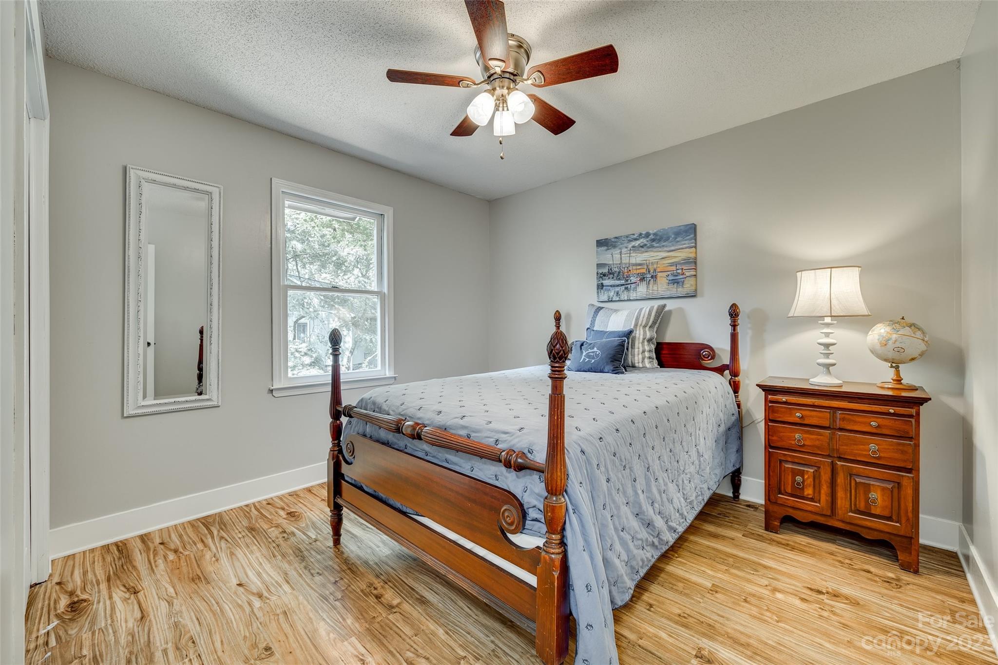 16064 Taku Court Tega Cay, SC 29708 - Photo 24 of 31 a bedroom with a bed and a dresser