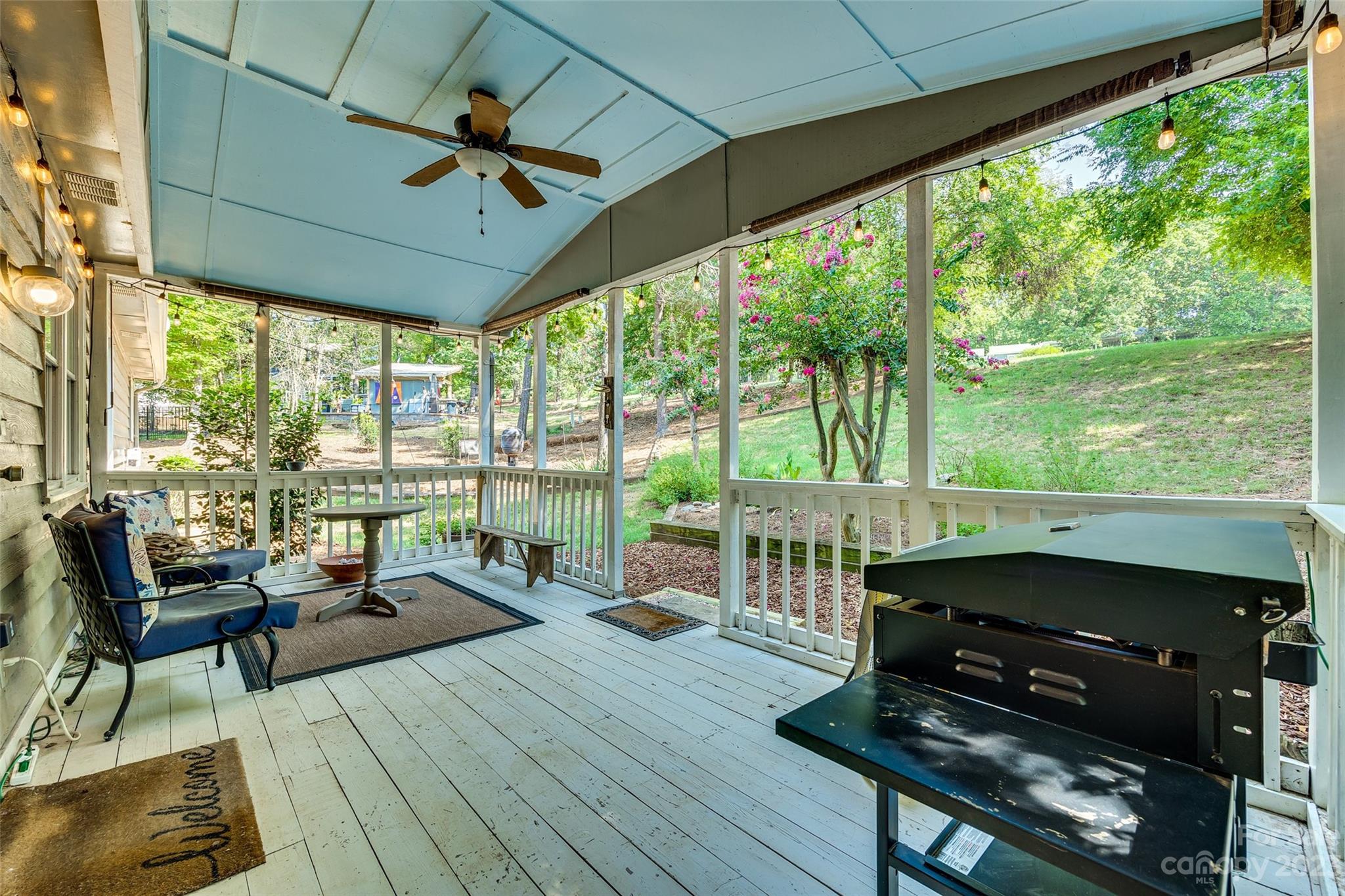 16064 Taku Court Tega Cay, SC 29708 - Photo 26 of 31 a living room with furniture and a floor to ceiling window
