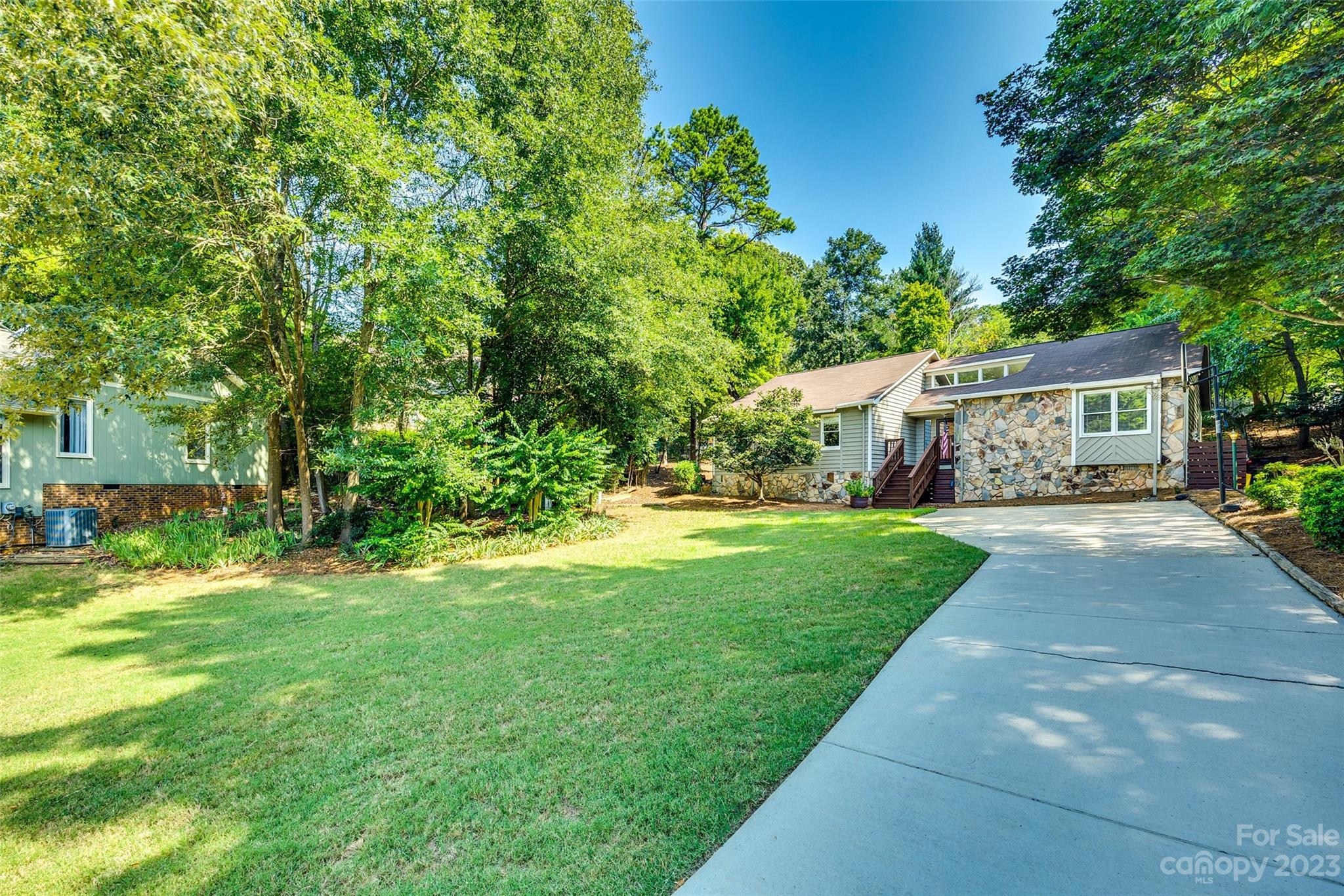 16064 Taku Court Tega Cay, SC 29708 - Photo 31 of 31 a view of house with outdoor space and garden