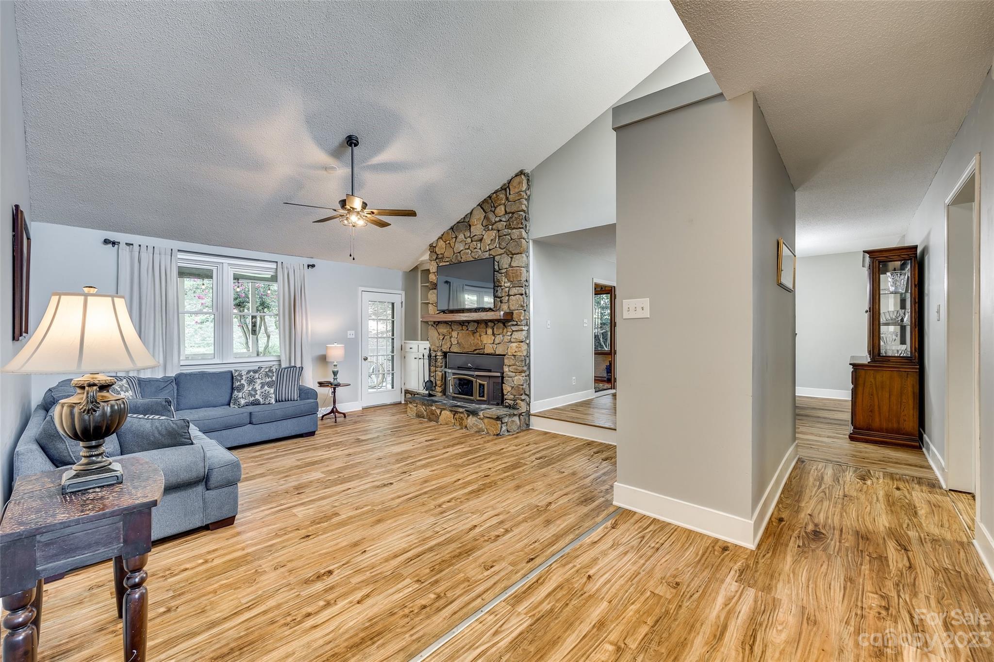 16064 Taku Court Tega Cay, SC 29708 - Photo 4 of 31 a living room with furniture and a wooden floor