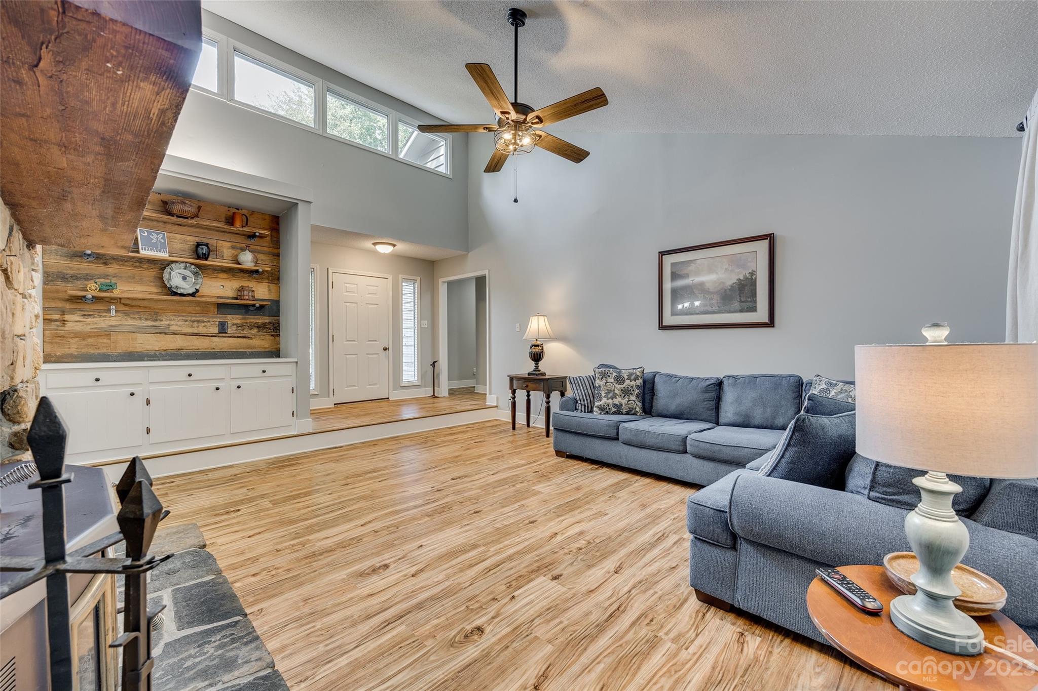 16064 Taku Court Tega Cay, SC 29708 - Photo 5 of 31 a living room with furniture and a wooden floor