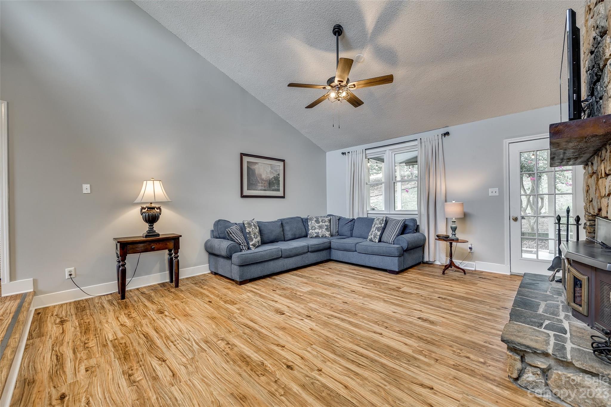 16064 Taku Court Tega Cay, SC 29708 - Photo 6 of 31 a bedroom with a large bed and a chandelier