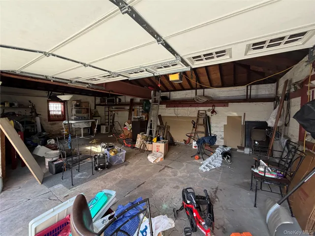 a utility room with sink dryer and washer