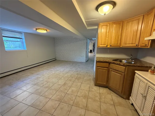 a front view of a building with parking space