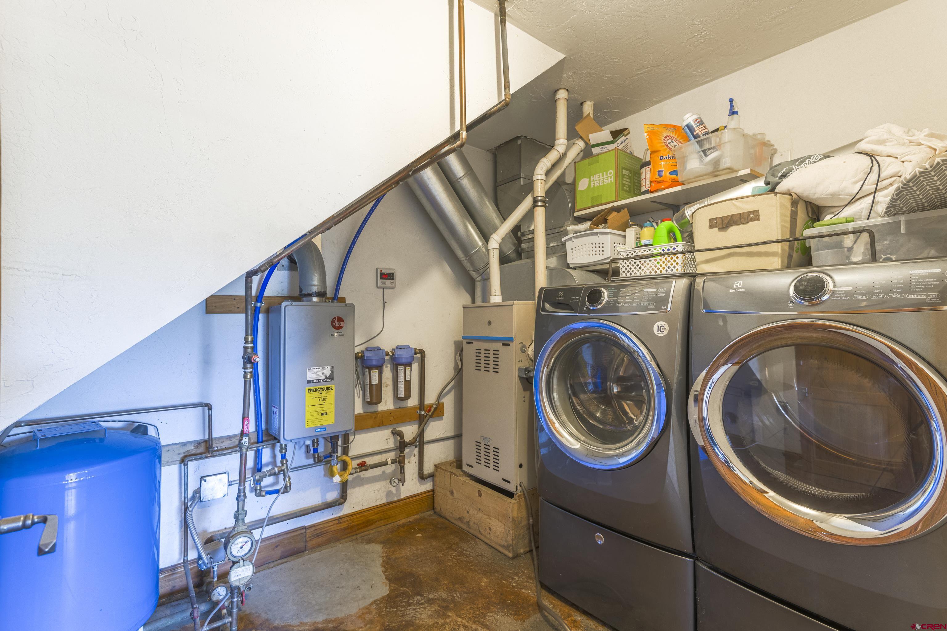 388 Columbine Road Gunnison, CO 81230 - Photo 11 of 45 a utility room with dryer and washer