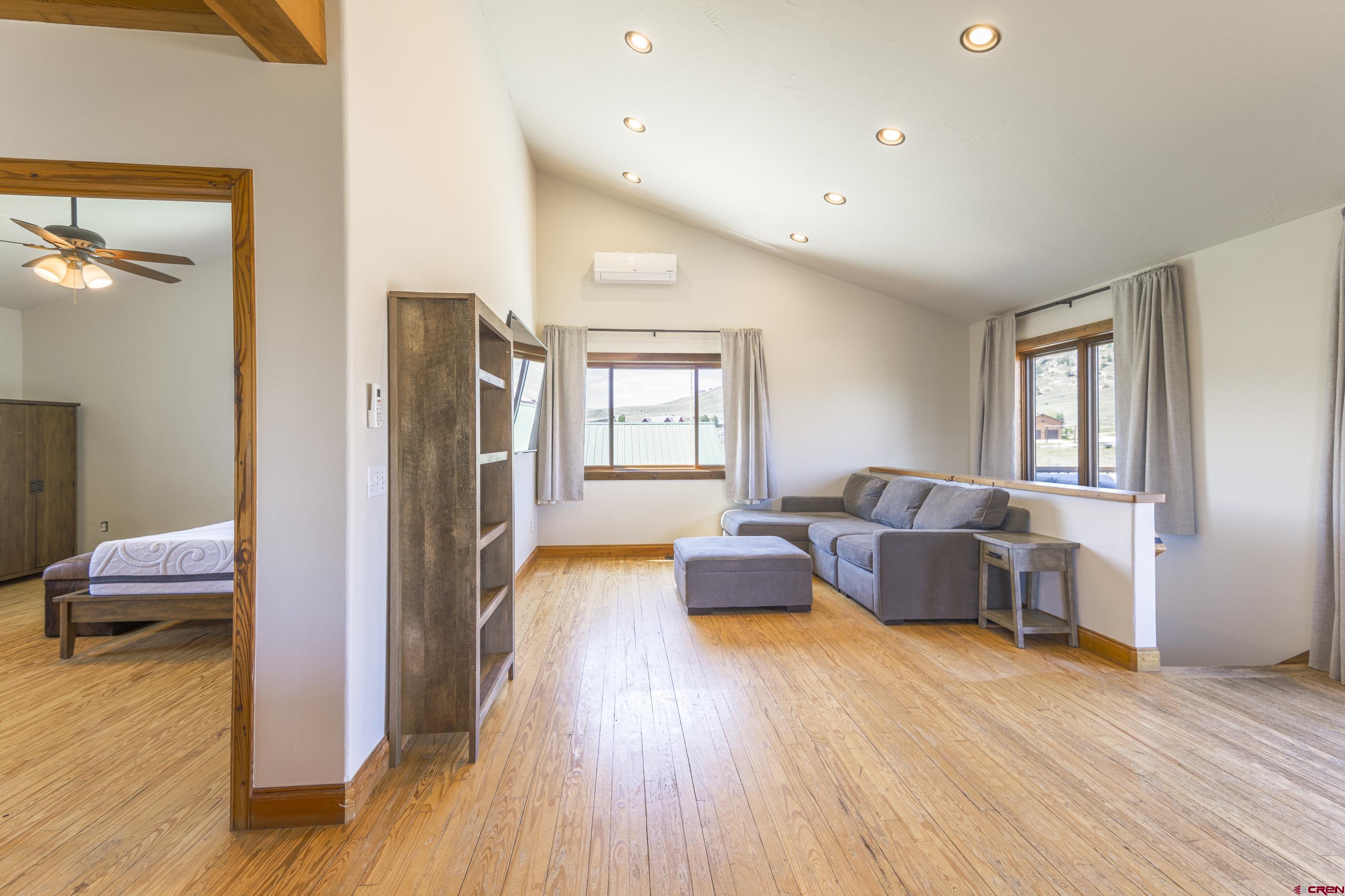 388 Columbine Road Gunnison, CO 81230 - Photo 20 of 45 a bedroom with furniture and wooden floor