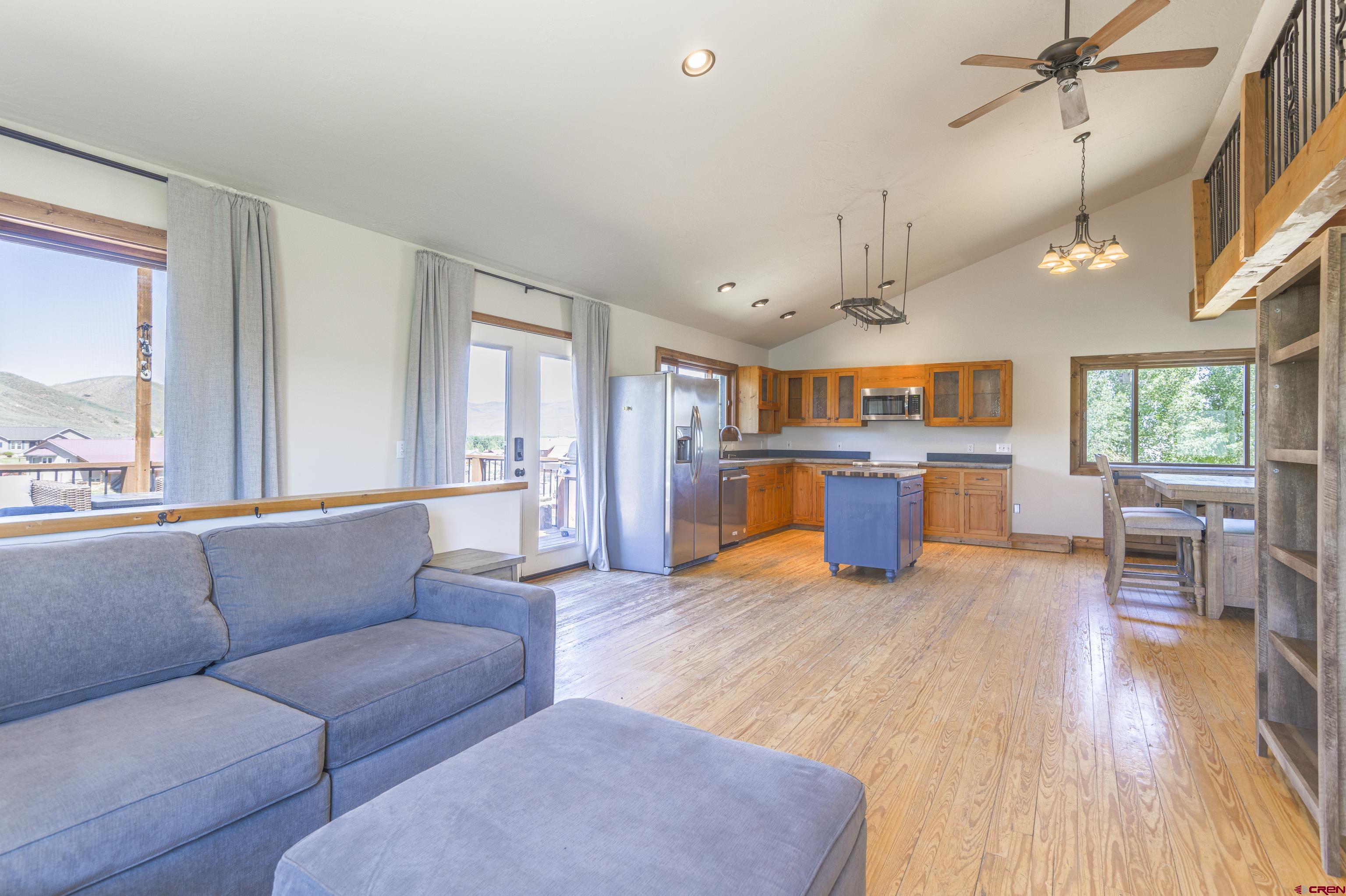 388 Columbine Road Gunnison, CO 81230 - Photo 21 of 45 a living room with furniture and kitchen view