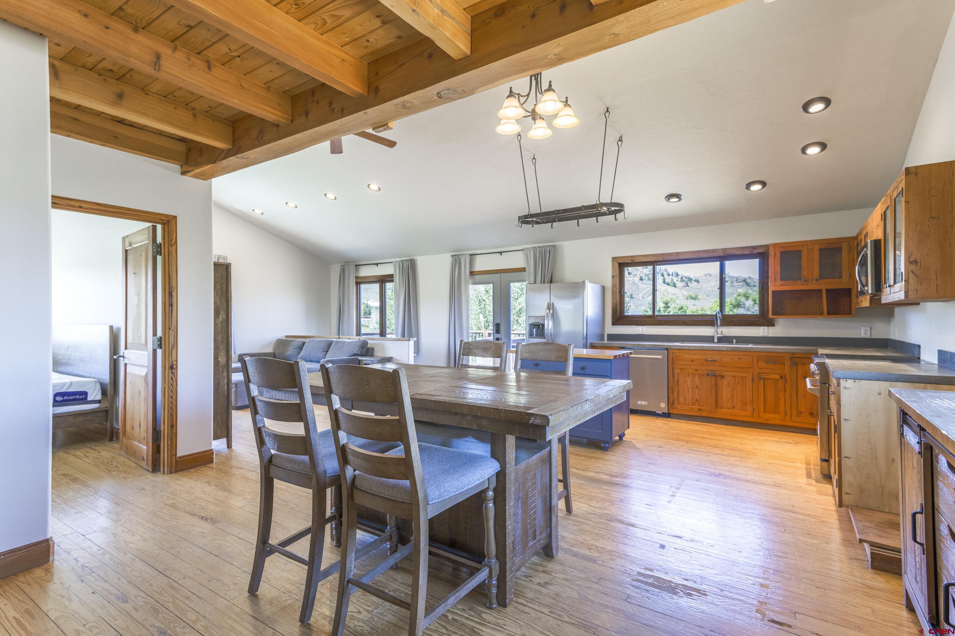388 Columbine Road Gunnison, CO 81230 - Photo 23 of 45 a view of a dining room with furniture and wooden floor