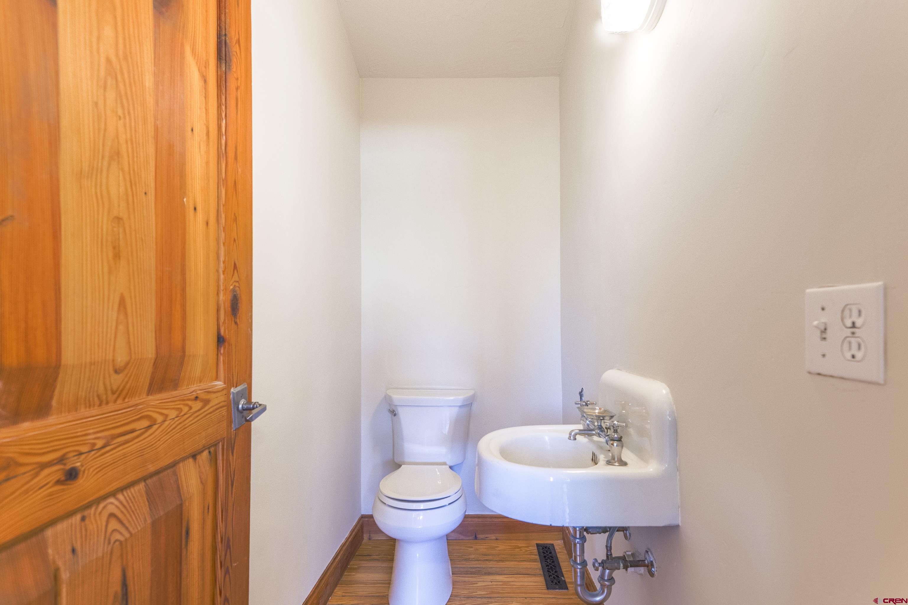 388 Columbine Road Gunnison, CO 81230 - Photo 25 of 45 a bathroom with a sink toilet and a mirror
