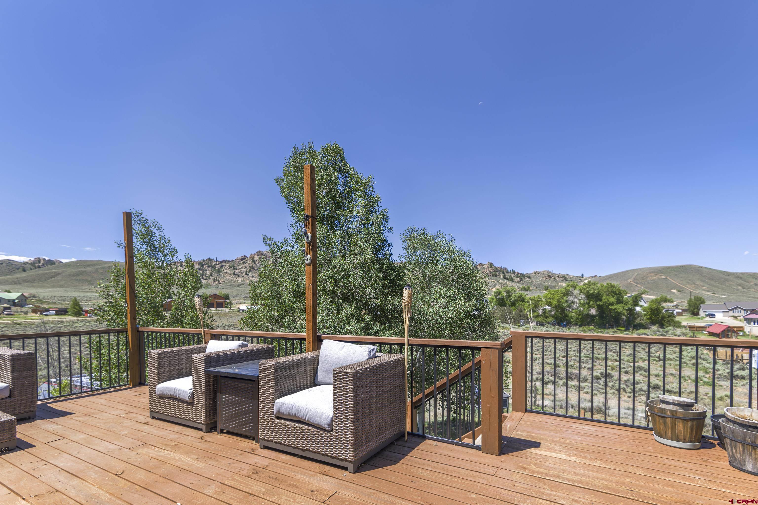 388 Columbine Road Gunnison, CO 81230 - Photo 30 of 45 a view of a balcony with wooden floor and fence
