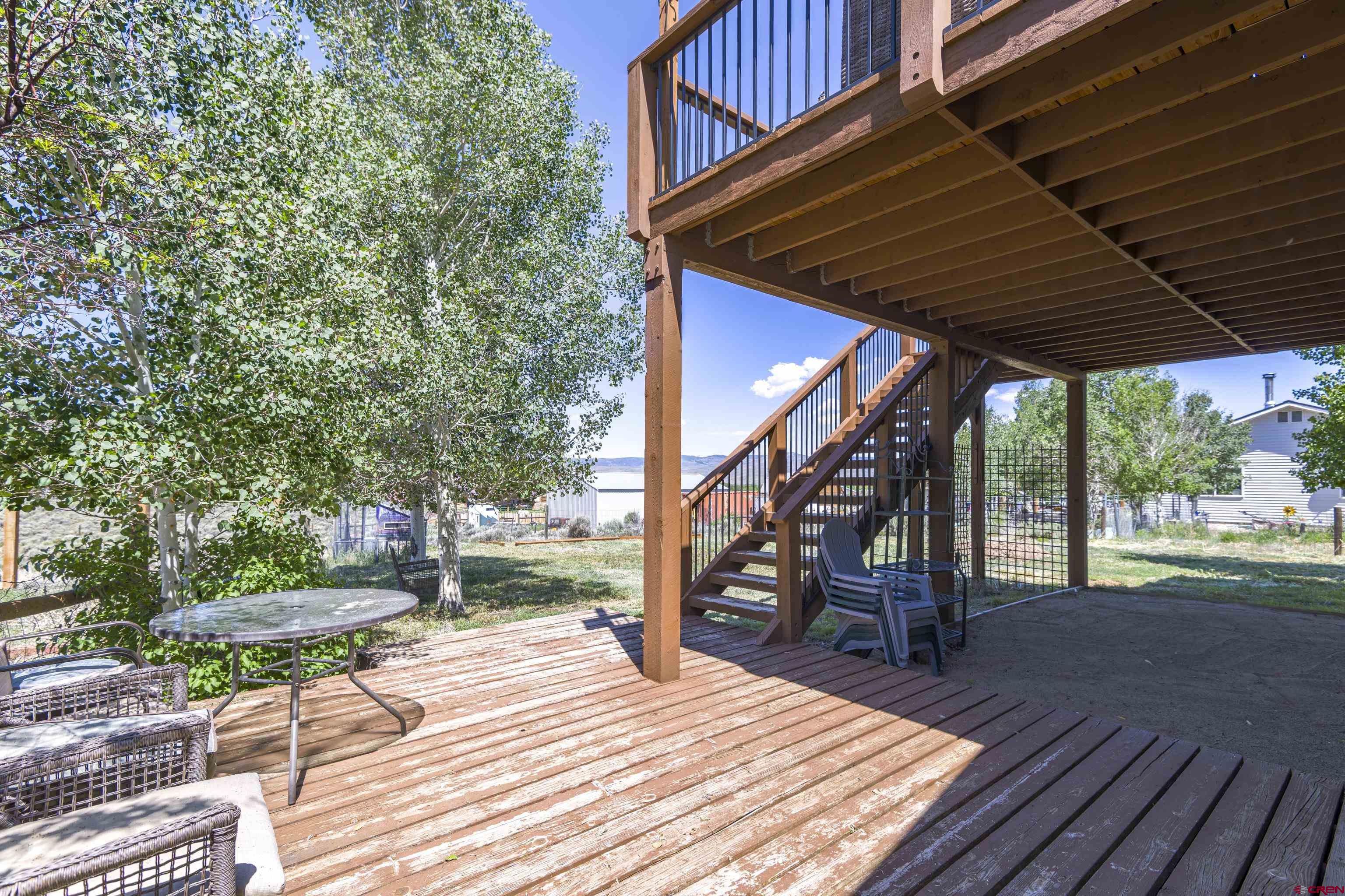 388 Columbine Road Gunnison, CO 81230 - Photo 35 of 45 a view of outdoor space with wooden floor and outdoor seating