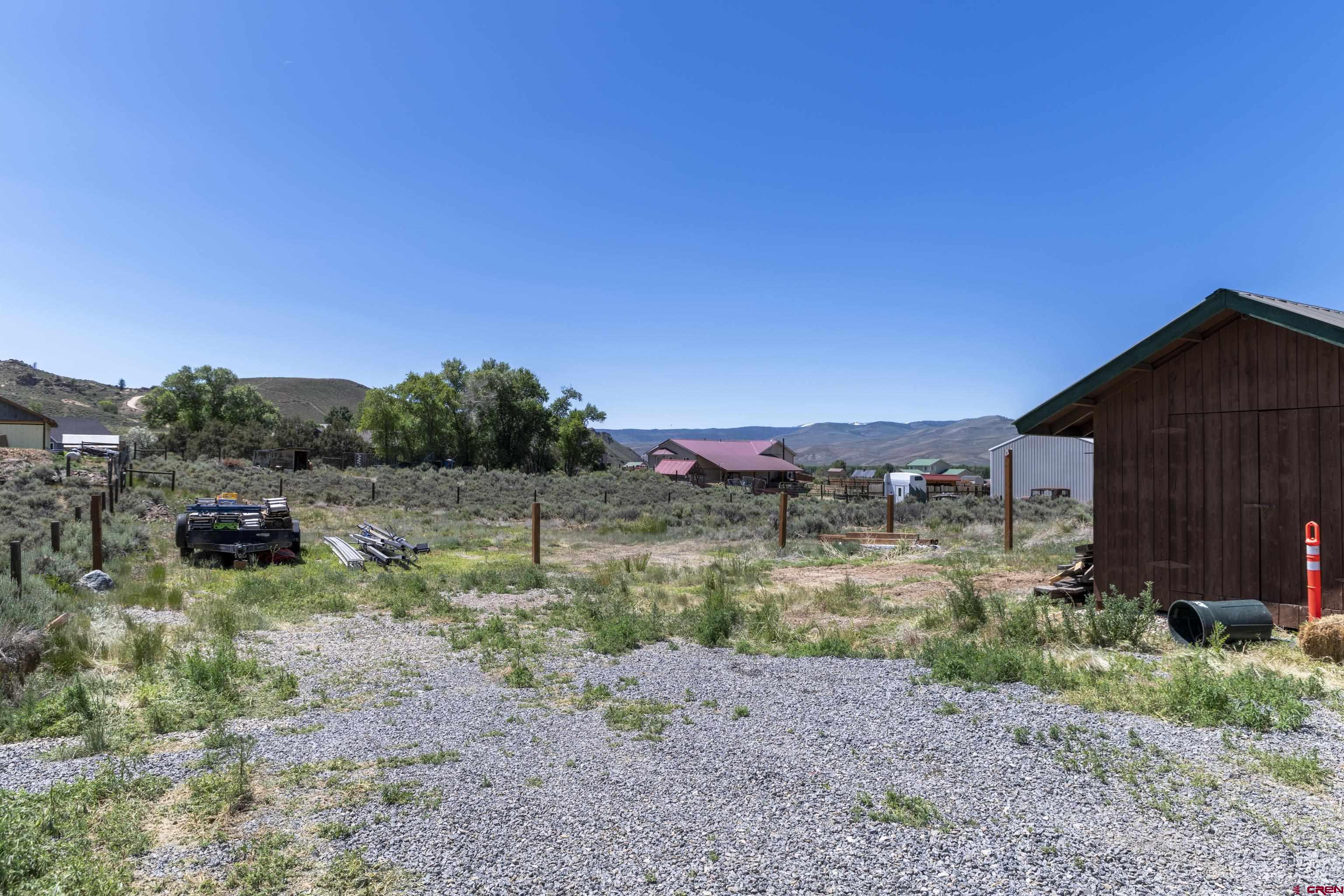388 Columbine Road Gunnison, CO 81230 - Photo 43 of 45 a backyard of a house with lots of green space