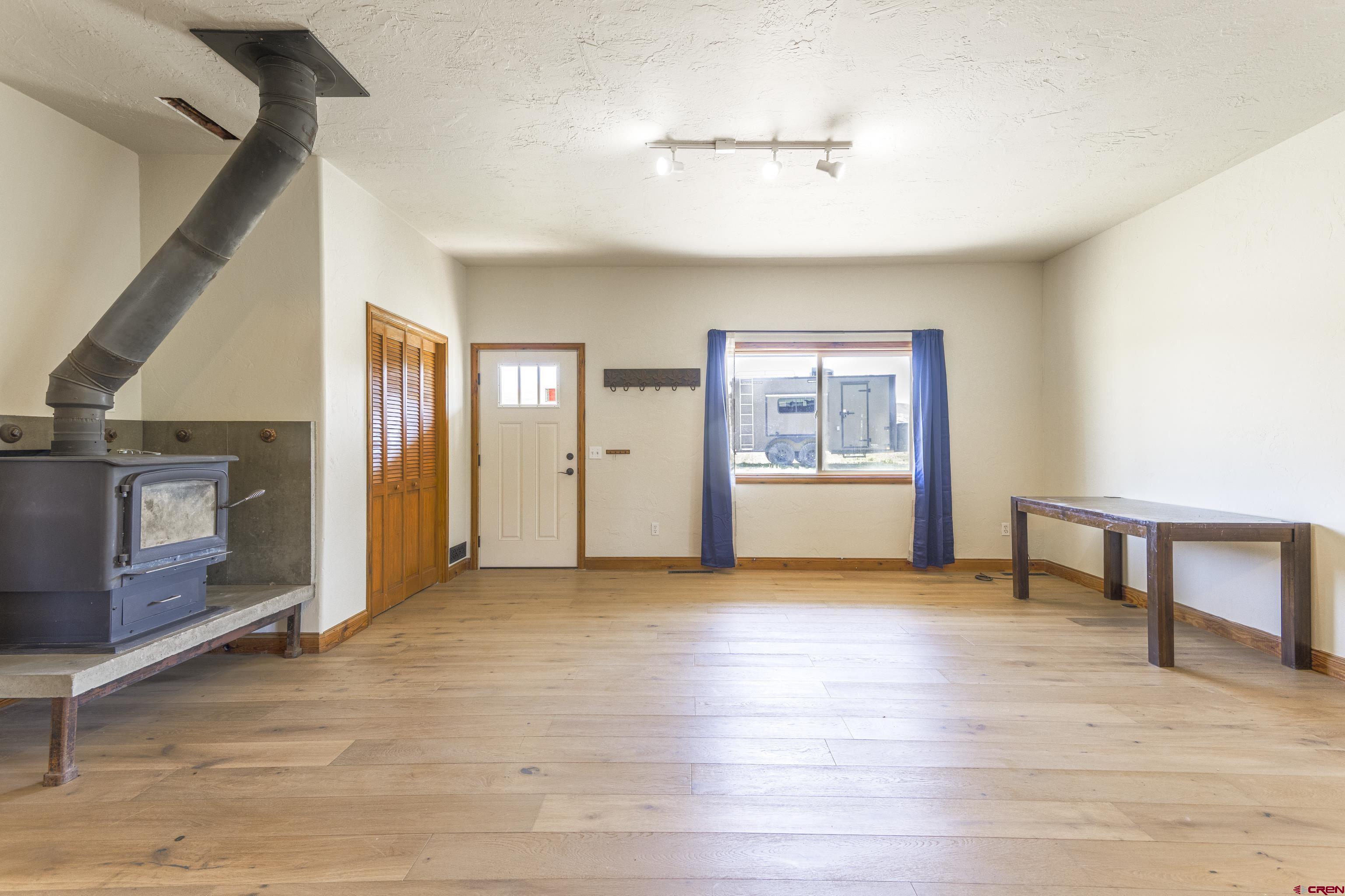 388 Columbine Road Gunnison, CO 81230 - Photo 5 of 45 a view of an empty room with window and cabinet