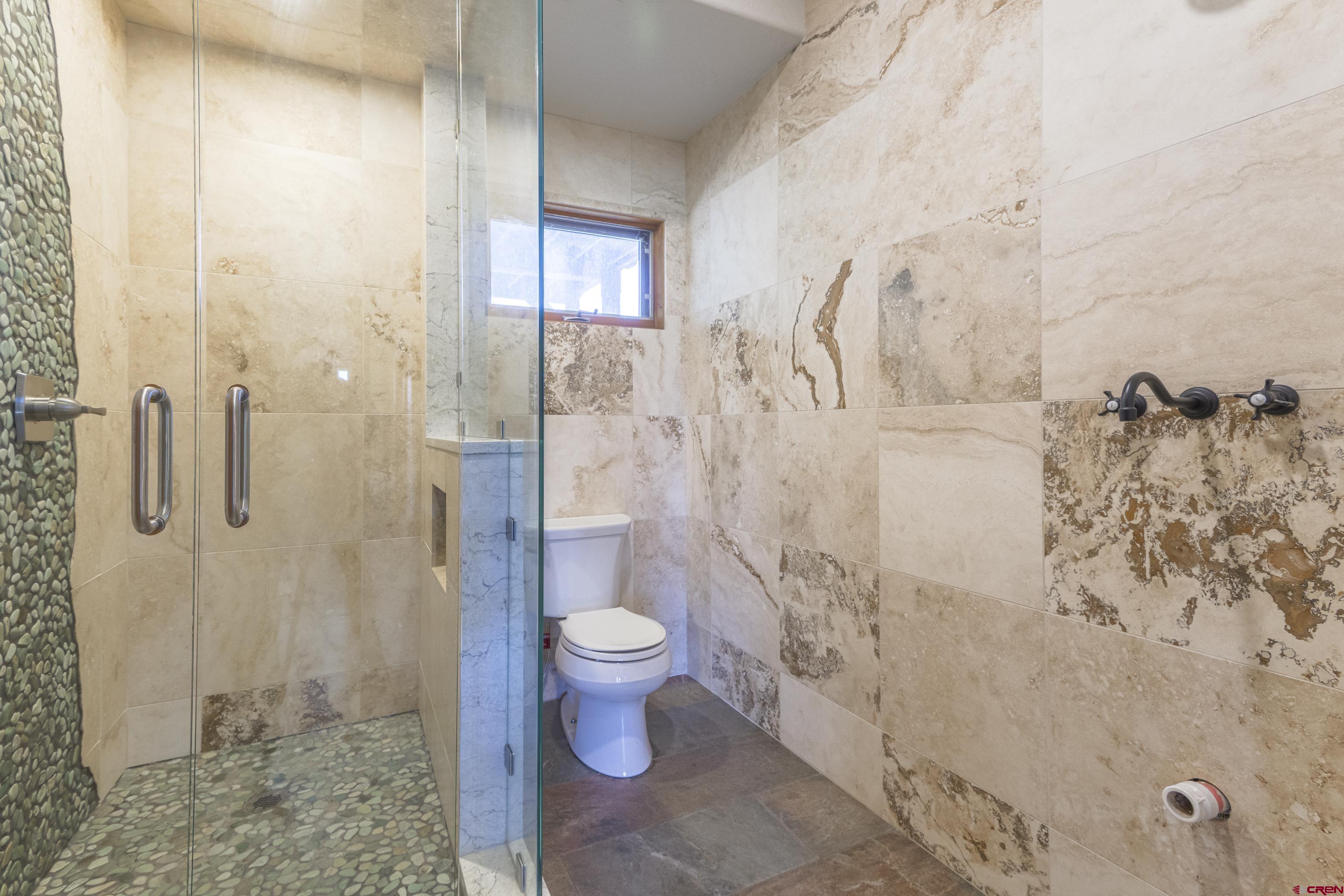 388 Columbine Road Gunnison, CO 81230 - Photo 10 of 45 a bathroom with a shower toilet and sink