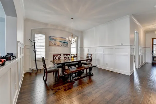 a living room with fireplace furniture and a flat screen tv