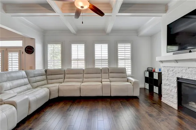 a kitchen with kitchen island granite countertop a sink a center island and stainless steel appliances