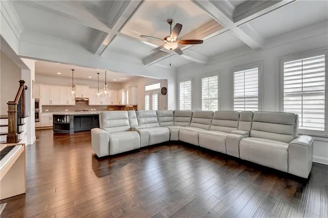 a kitchen with stainless steel appliances granite countertop sink stove and refrigerator