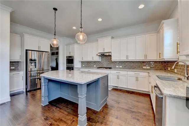a bedroom with a bed couch and window