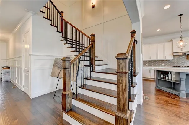 a en suite bathroom with a granite countertop sink and a mirror