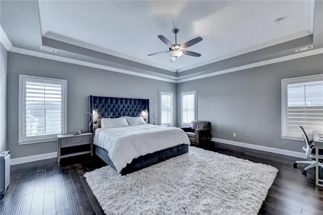 a living room with a bed furniture and a window