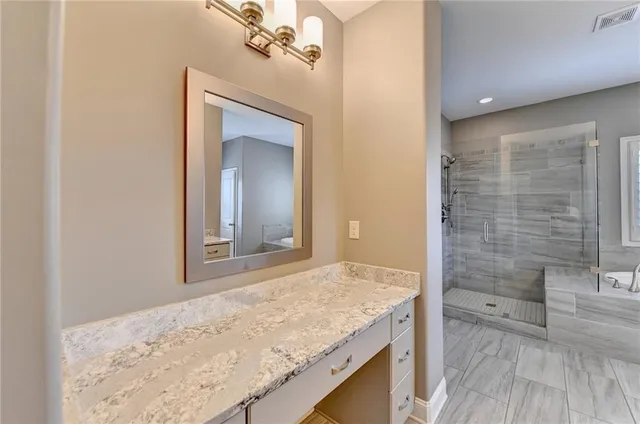 a view of walk in closet with wooden floor and staircase
