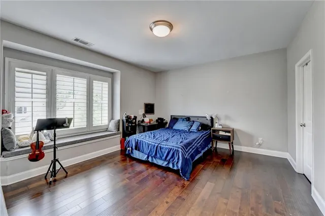 an aerial view of a house with garden space and lake view