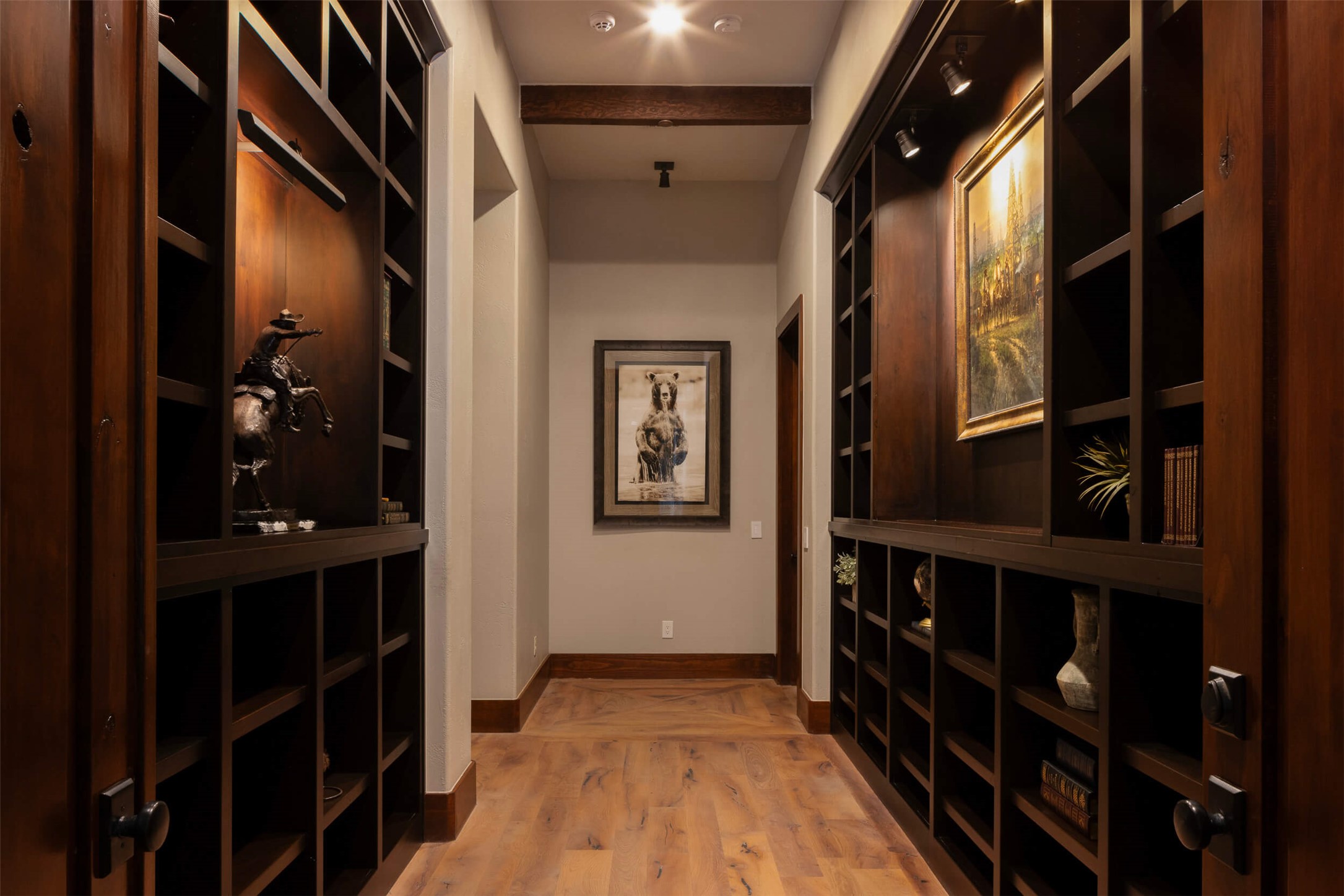 15016 Flat Top Ranch Road Austin, TX 78732 - Photo 28 of 40 Wine room featuring light wood-style flooring and baseboards