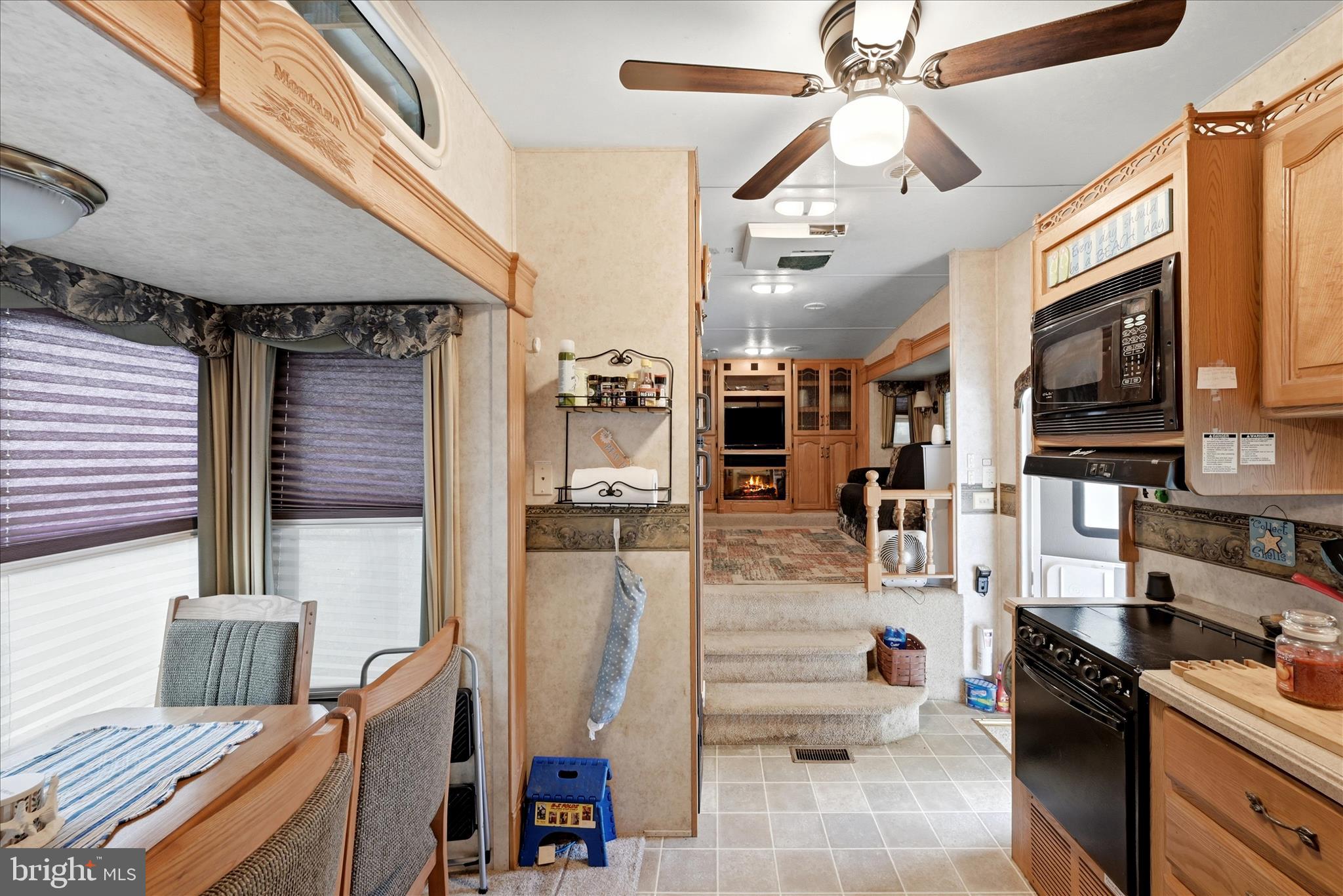 Lot 20 Hot Dog Road Falling Waters, WV 25419 - Photo 9 of 26 a kitchen with stainless steel appliances kitchen island granite countertop a refrigerator and a stove
