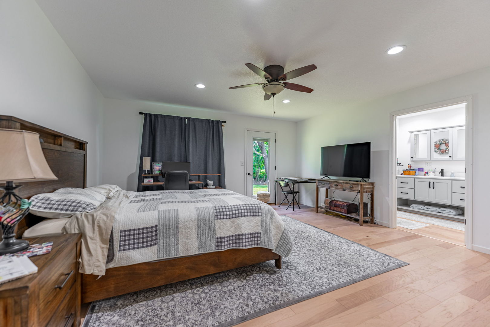 102 Sunset Lane Prophetstown, IL 61277 - Photo 18 of 41 a bedroom with a bed a couch and a flat screen tv