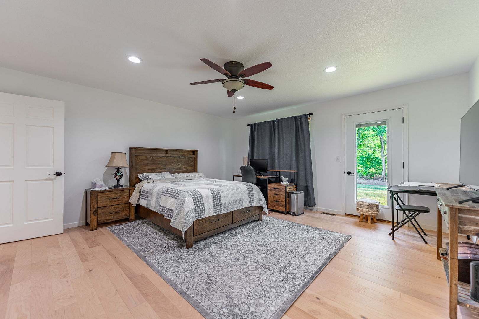 102 Sunset Lane Prophetstown, IL 61277 - Photo 19 of 41 a bedroom with a large bed a rug and a window