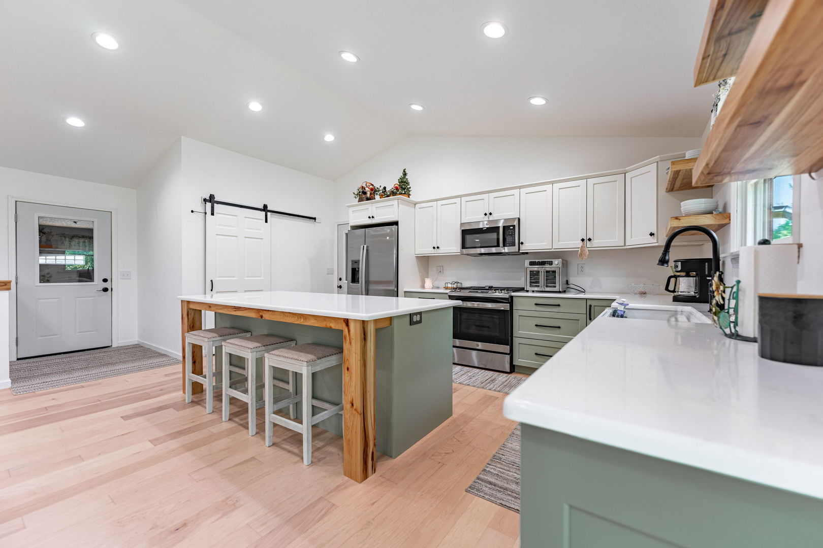 102 Sunset Lane Prophetstown, IL 61277 - Photo 8 of 41 a kitchen with kitchen island granite countertop a sink a counter top space stainless steel appliances and cabinets