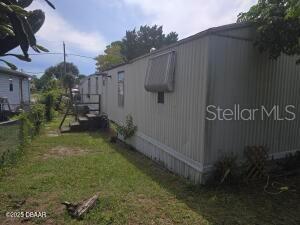117 Coleman Street Edgewater, FL 32141 - Photo 5 of 5 a backyard of a house