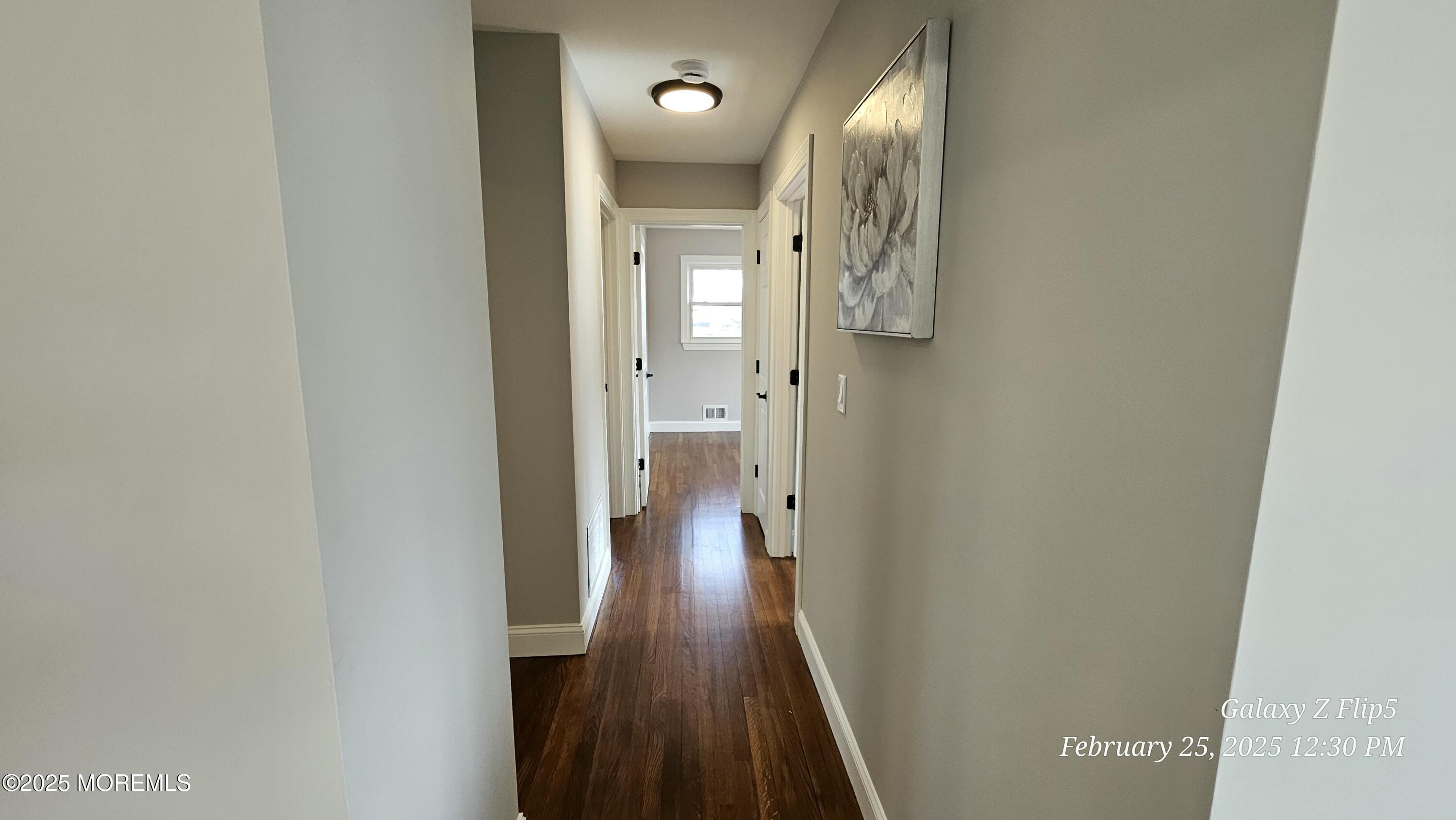 Park Avenue Freehold, NJ 07728 - Photo 6 of 18 a view of a hallway with wooden floor