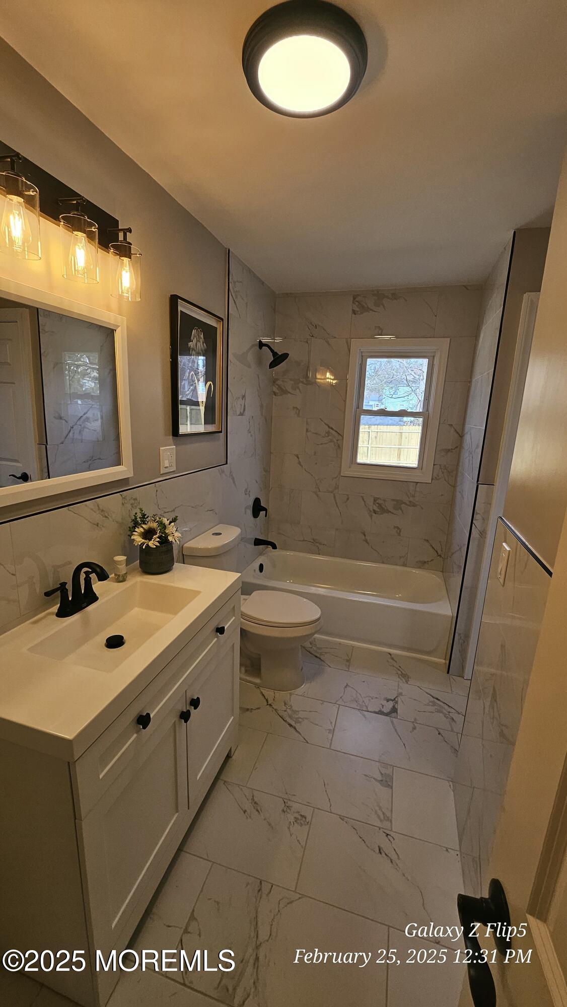 Park Avenue Freehold, NJ 07728 - Photo 7 of 18 a bathroom with a tub sink and mirror
