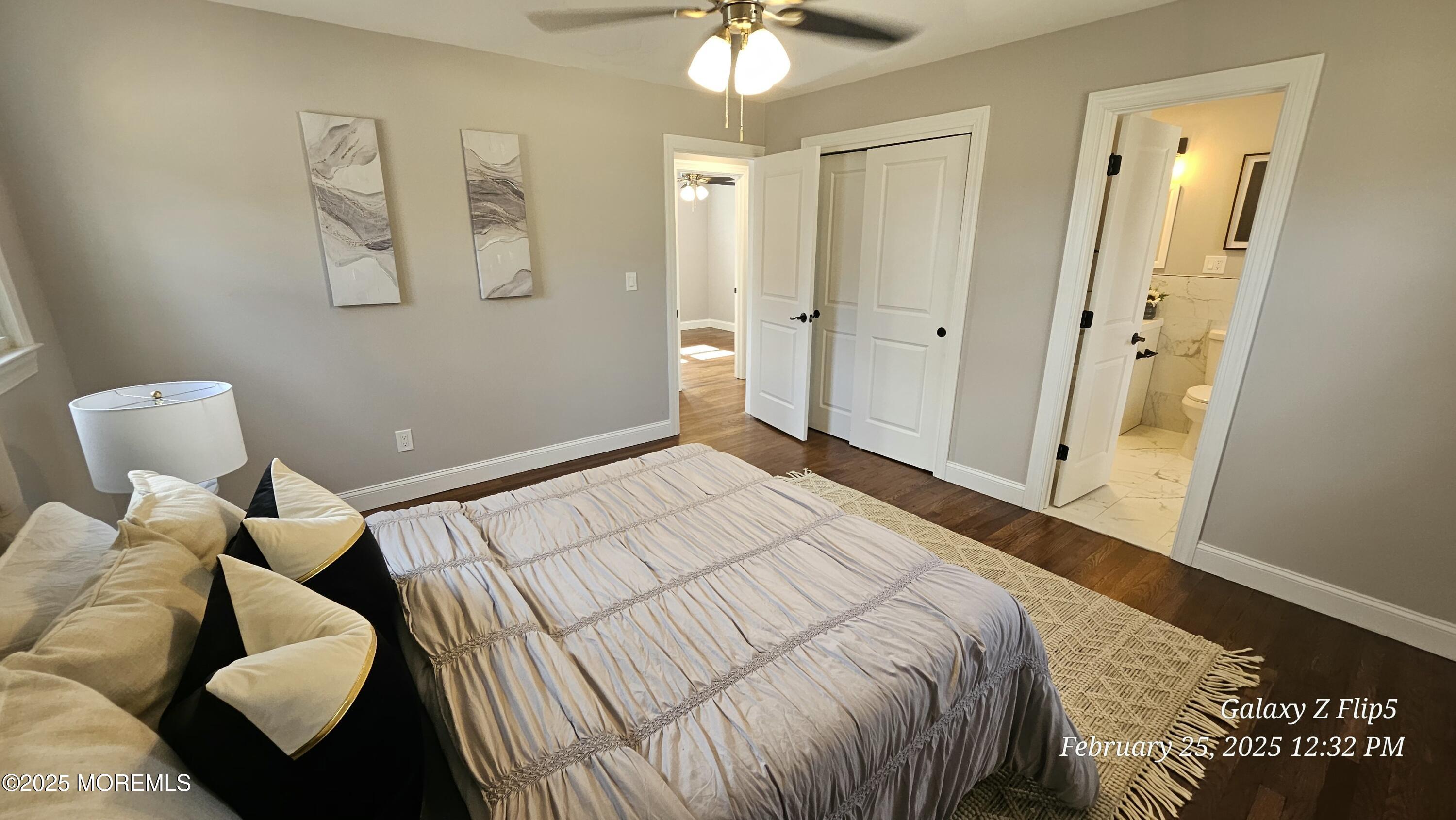 Park Avenue Freehold, NJ 07728 - Photo 9 of 18 a bedroom with a bed and a chandelier