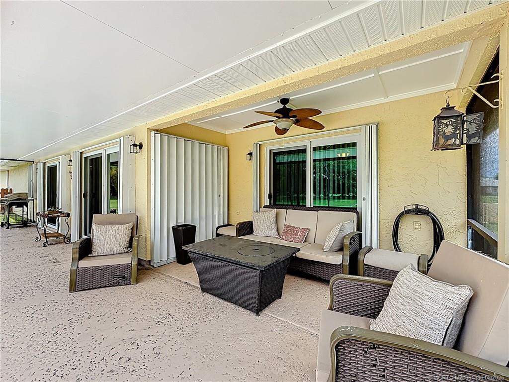 2082 Southeast Pyramid Road Port St. Lucie, FL 34952 - Photo 64 of 87 COVERED PATIO AREA 12X39 SCREENED AREA AND PATIO 19 X 39