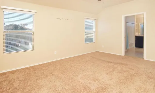 a view of empty room with windows