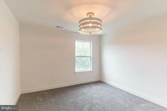 a view of empty room with windows