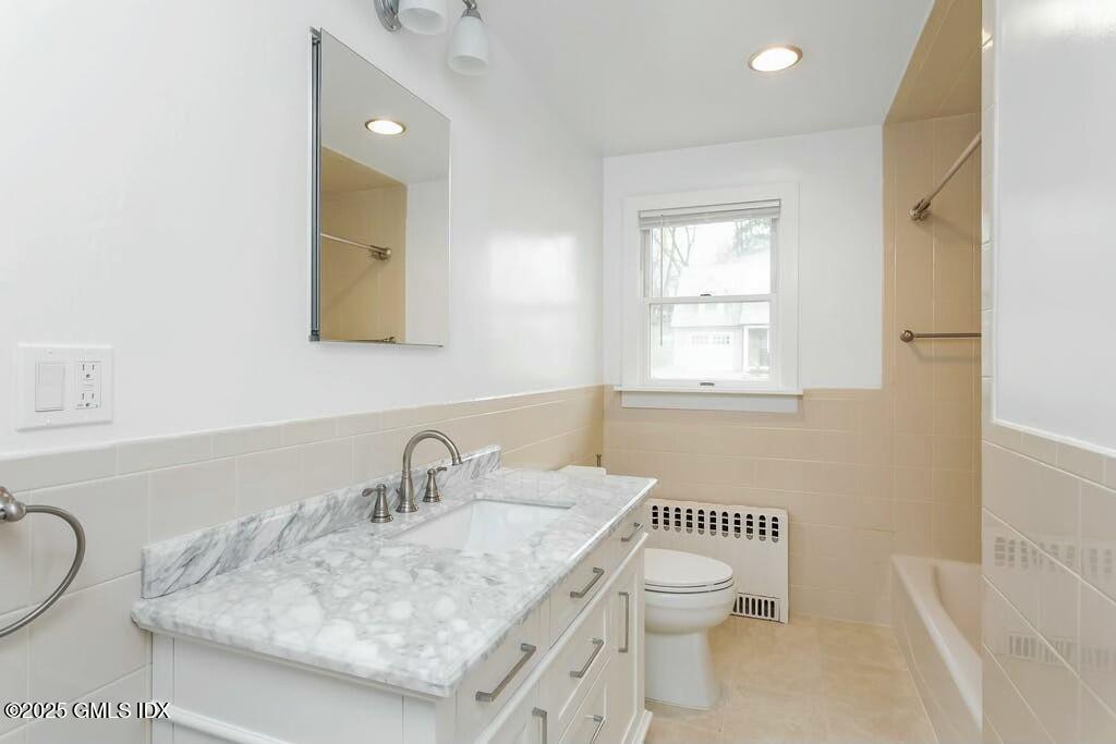 304 Valley Road Cos Cob, CT 06807 - Photo 14 of 21 a bathroom with a granite countertop sink a toilet and a mirror