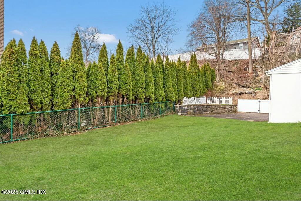304 Valley Road Cos Cob, CT 06807 - Photo 18 of 21 a view of yard with green space