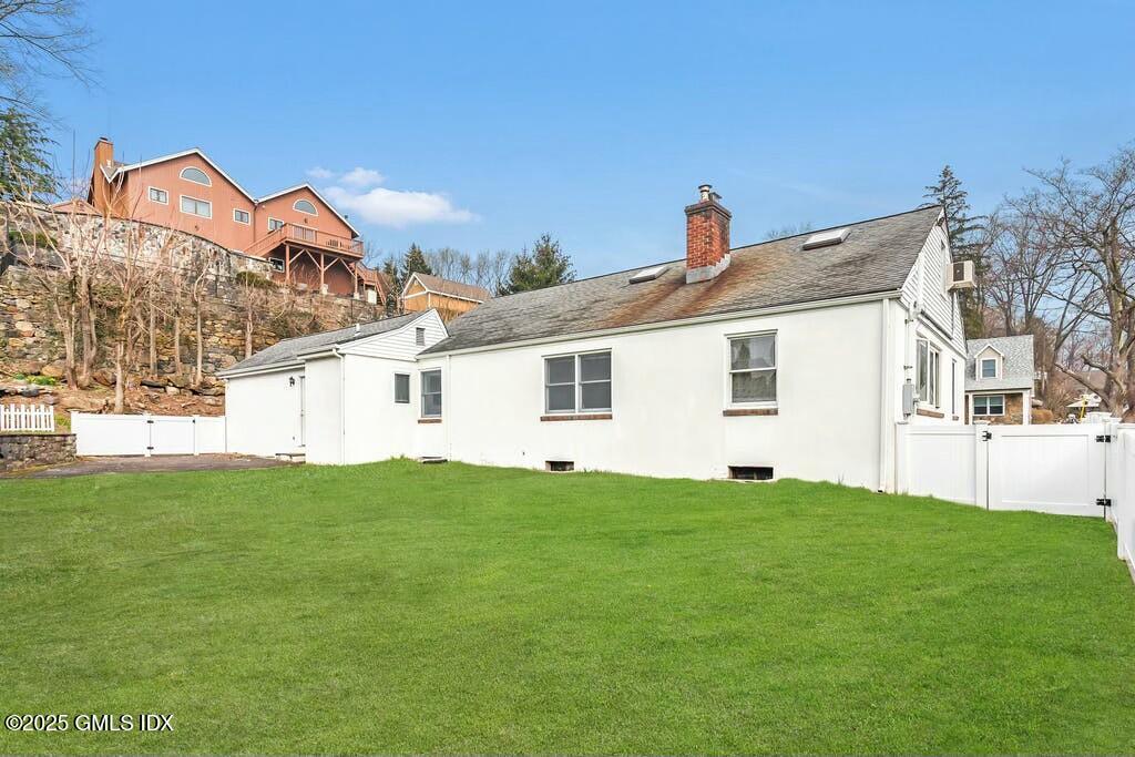 304 Valley Road Cos Cob, CT 06807 - Photo 19 of 21 a view of a house with a backyard