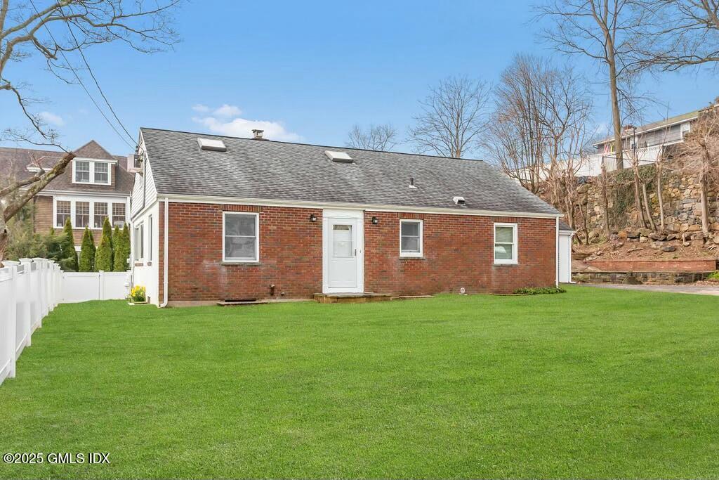 304 Valley Road Cos Cob, CT 06807 - Photo 2 of 21 a view of a yard in front of a house with large tree