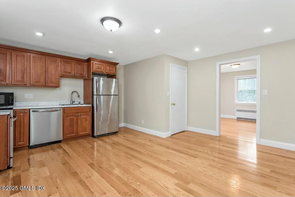 304 Valley Road Cos Cob, CT 06807 - Photo 6 of 21 a kitchen with stainless steel appliances granite countertop a refrigerator a sink and a stove