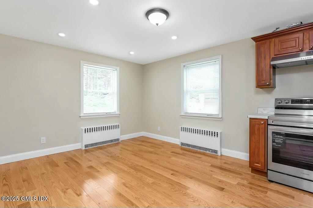 304 Valley Road Cos Cob, CT 06807 - Photo 7 of 21 a view of empty room with a fireplace and wooden floor
