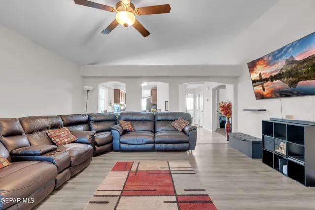 a living room with fireplace furniture and a flat screen tv