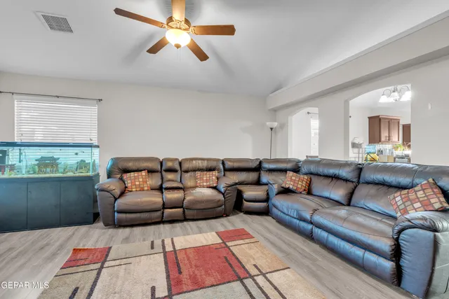 a living room with furniture and a window